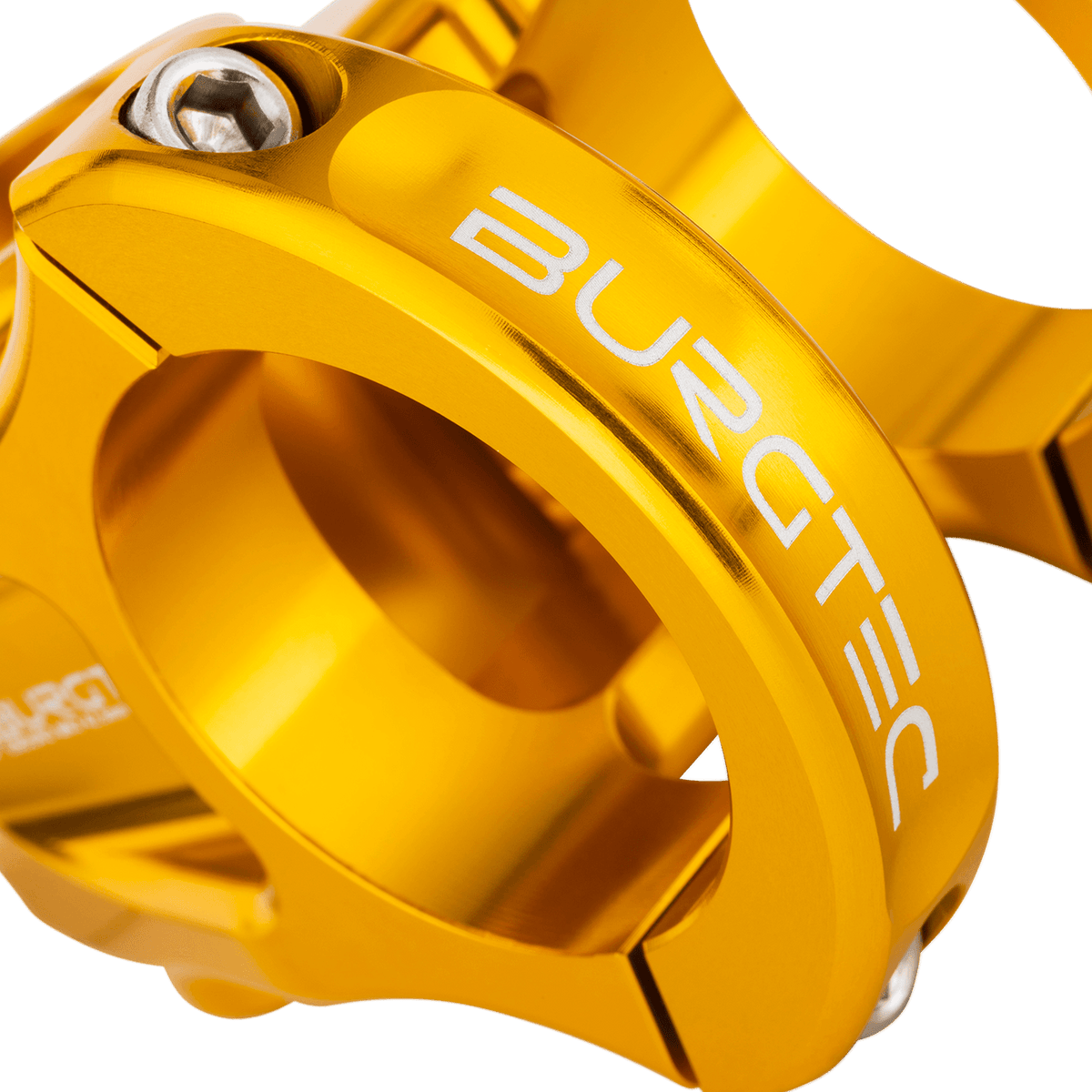 Avanço BURGTEC ENDURO MK3 dourado — detalhe do aperto do guiador